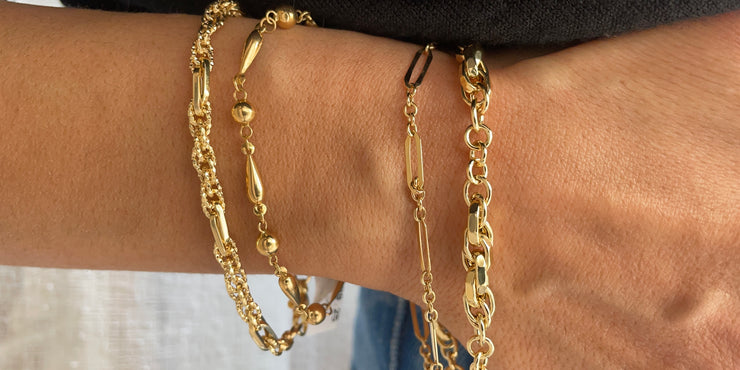 Jewellery stack, gold bracelets