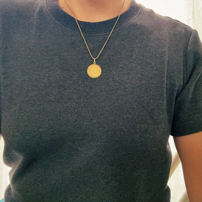 Coin pendant on model 