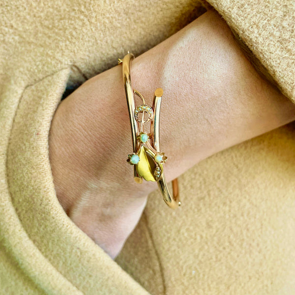 moon flower and leaf bangle worn on model