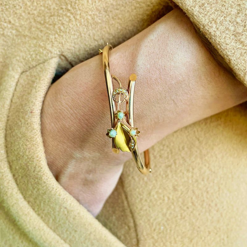 moon flower and leaf bangle worn on model