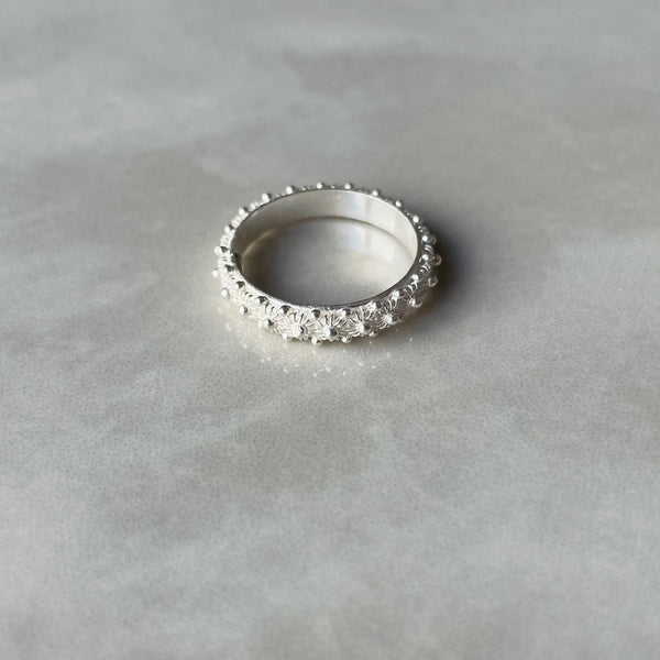 Silver ring with bead design on a grey background | Deheb Jewellery Malta