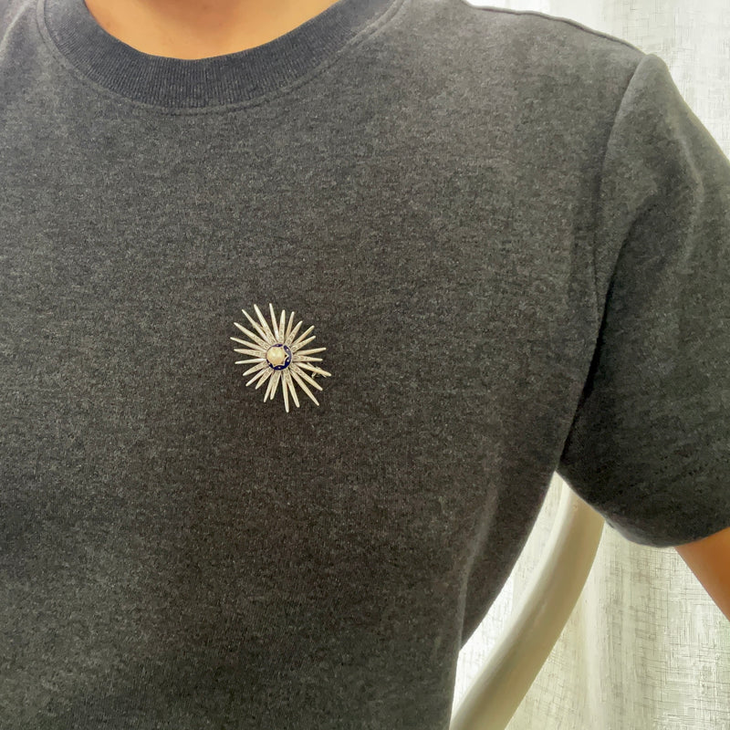 Star brooch with pearl on model