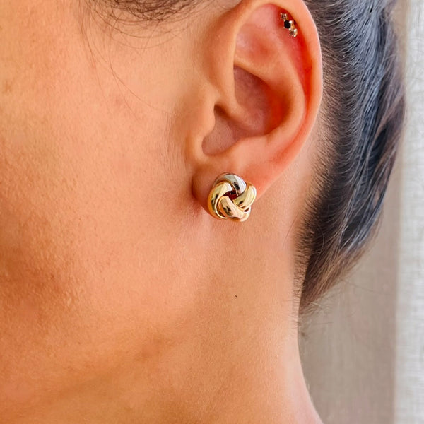 Gold knot earring worn on model | Deheb Jewellery Malta