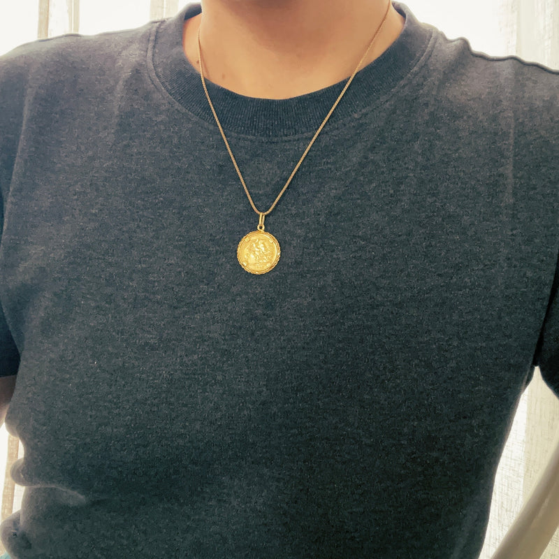 Coin pendant on model 